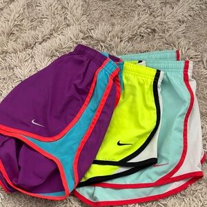 Nike Women's Shorts Trio in Purple, Neon Yellow, and Light Blue